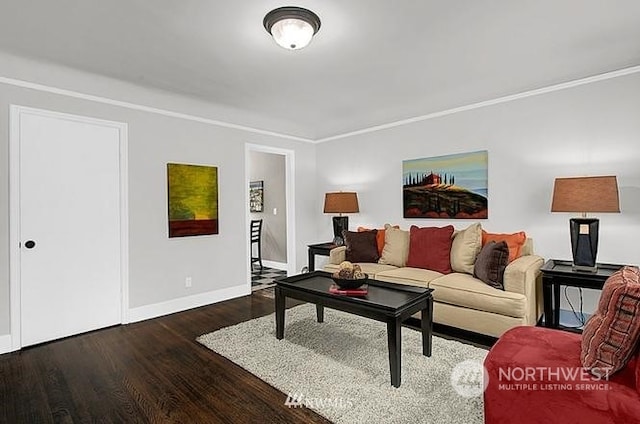 living room featuring ornamental molding and dark wood-type flooring