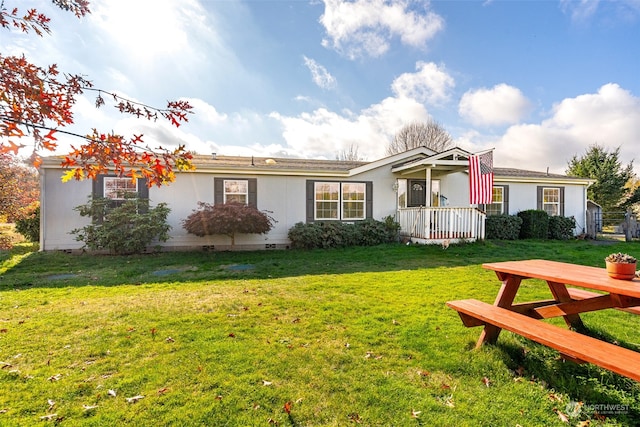 ranch-style home with a front lawn