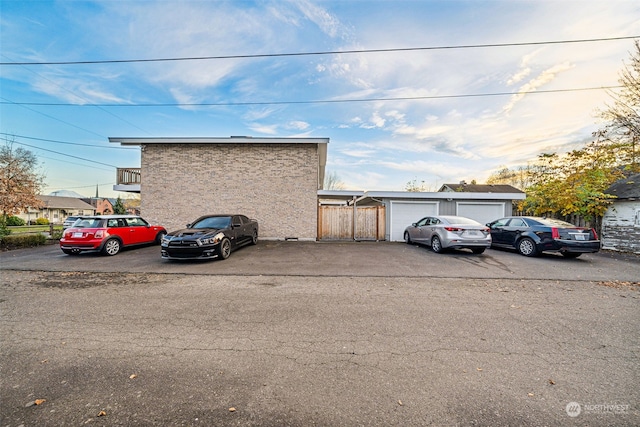 view of parking with a garage