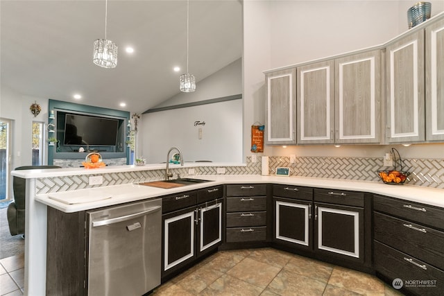 kitchen featuring hanging light fixtures, sink, dishwasher, kitchen peninsula, and lofted ceiling