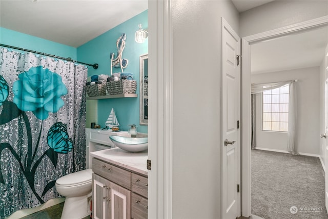 bathroom featuring toilet and vanity