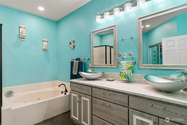 bathroom featuring vanity, plus walk in shower, and tile patterned flooring