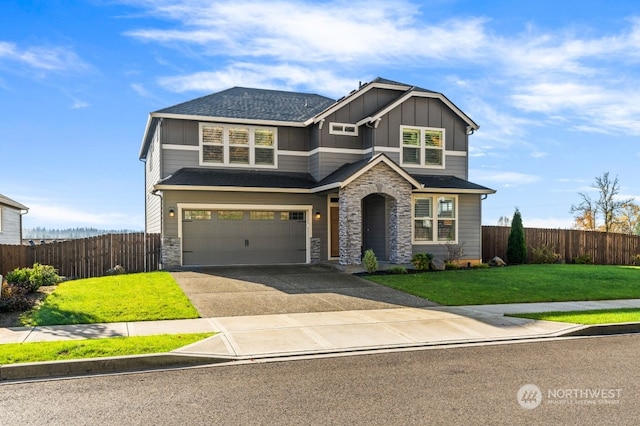 craftsman-style home featuring a front yard and a garage