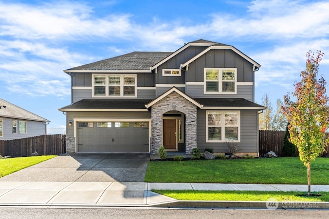 view of front facade with a garage and a front yard