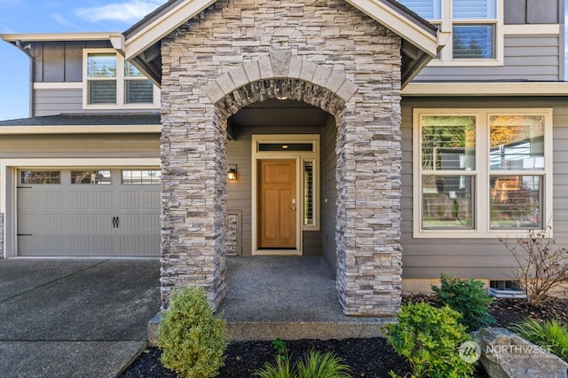 view of exterior entry featuring a garage