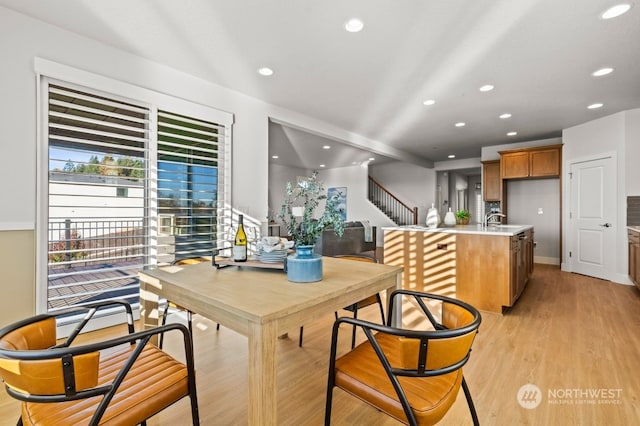 kitchen with light hardwood / wood-style floors and sink