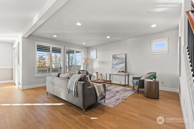 living room with light hardwood / wood-style floors and a textured ceiling