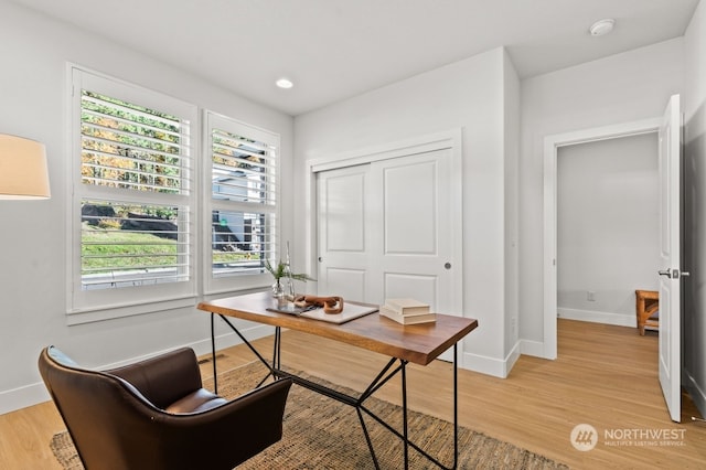 office featuring light hardwood / wood-style flooring and plenty of natural light