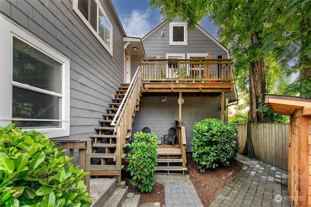 back of house featuring a wooden deck