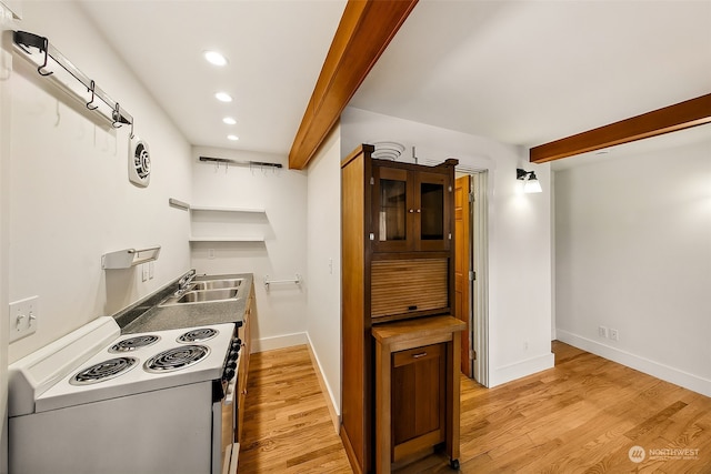 kitchen with white electric stove, beamed ceiling, sink, and light hardwood / wood-style floors