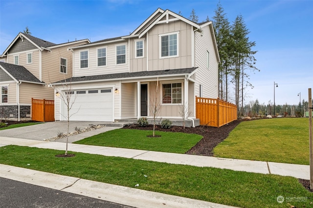 craftsman house featuring a front lawn and a garage