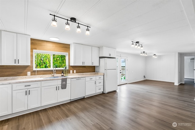 kitchen with white cabinetry, white appliances, dark hardwood / wood-style flooring, and sink