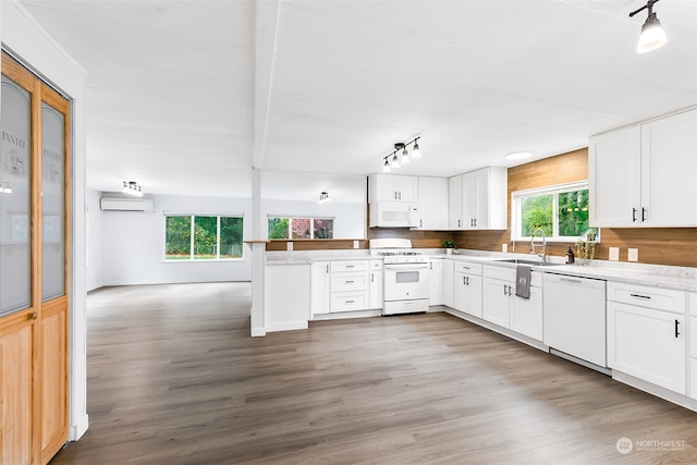 kitchen with sink, white cabinets, and white appliances