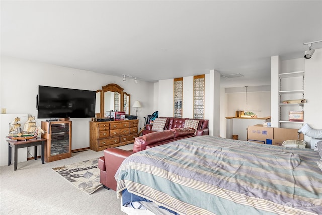 bedroom with light colored carpet