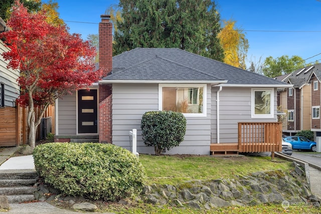 bungalow with a front lawn