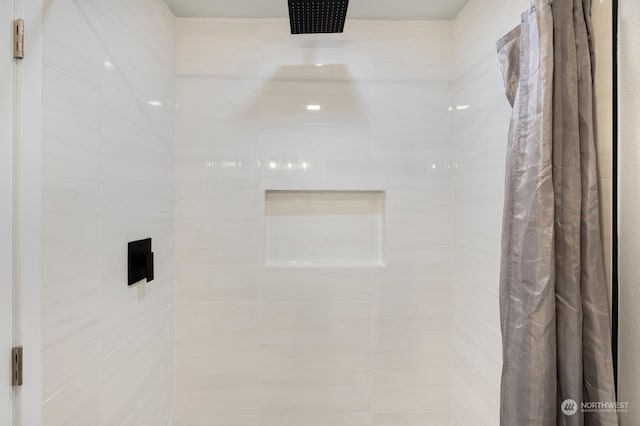 bathroom featuring a shower with curtain