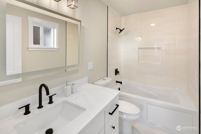 full bathroom featuring vanity, toilet, and tiled shower / bath combo