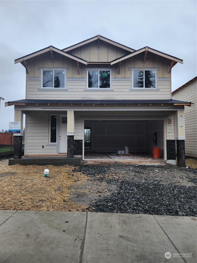 view of front of home with covered porch and a garage