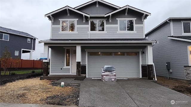 view of front of property featuring a garage and a porch