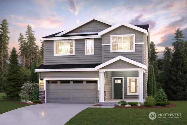 view of front facade featuring a garage, a front lawn, and concrete driveway