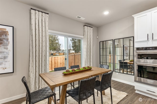 dining area featuring dark hardwood / wood-style floors