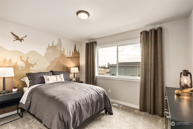 bedroom with carpet, visible vents, and baseboards