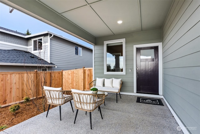 view of patio / terrace featuring outdoor lounge area and fence