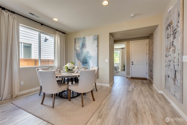 dining room with light hardwood / wood-style flooring