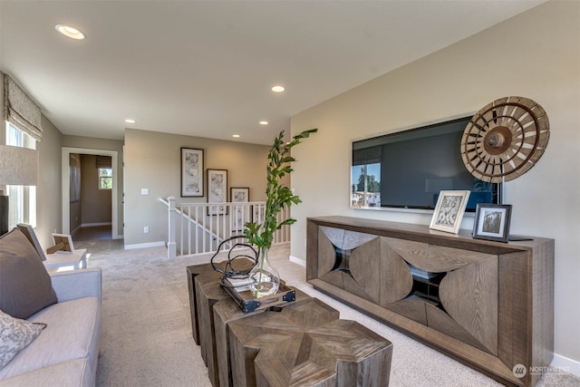 living room with light colored carpet