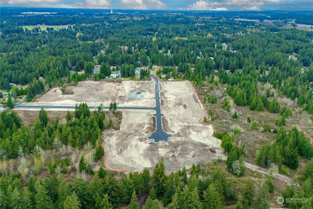 25708 64th Avenue Ct E Unit 4, Graham, WA 98338 - aerial view of property and surrounding area featuring a heavily wooded area
