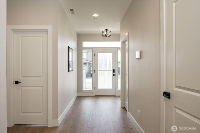 25708 64th Avenue Ct E Unit 4, Graham, WA 98338 - doorway with baseboards and wood finished floors