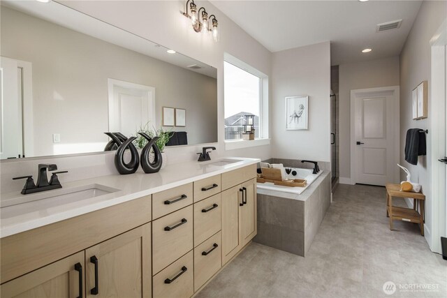 25708 64th Avenue Ct E Unit 4, Graham, WA 98338 - bathroom with double vanity, a bath, recessed lighting, and a shower