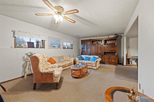 living room featuring ceiling fan, a textured ceiling, and pool table