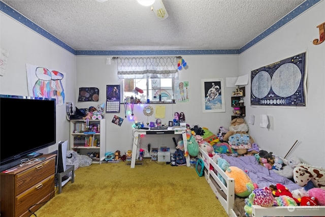 bedroom featuring ceiling fan, carpet floors, and a textured ceiling
