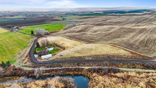 drone / aerial view with a rural view and a water view