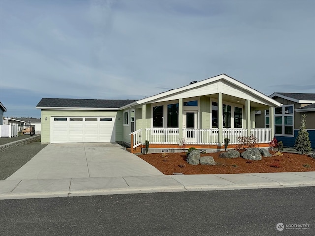 view of front of house with a porch and a garage