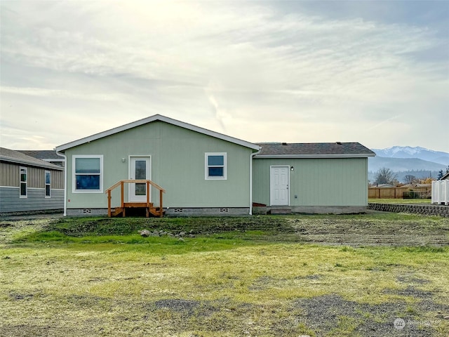 rear view of house with a mountain view