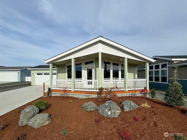 view of front of home featuring a porch and a garage