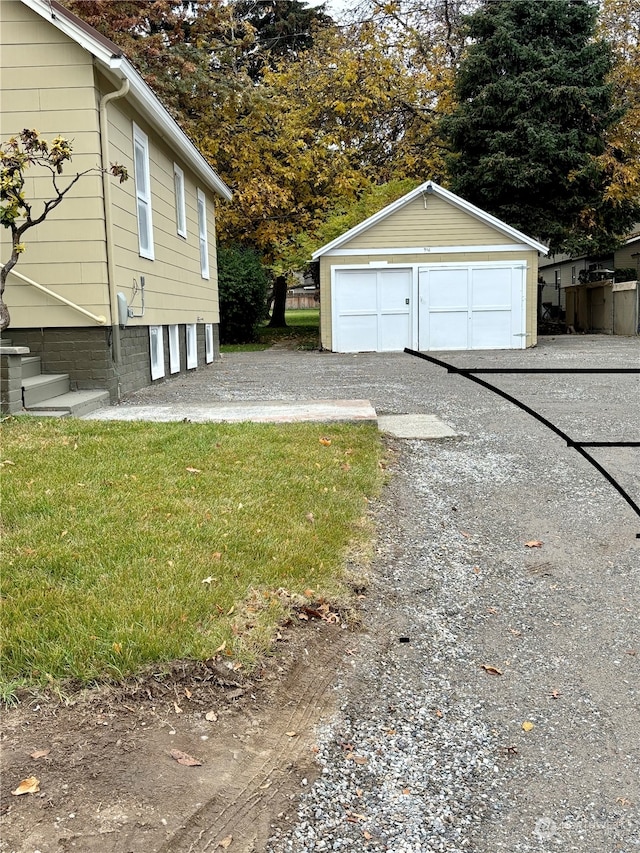 exterior space featuring a garage and an outdoor structure