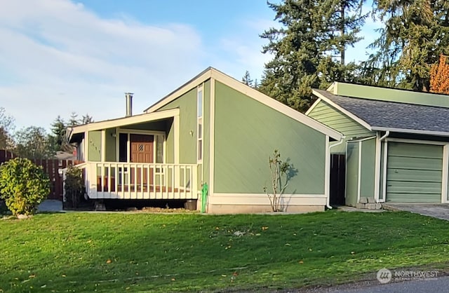 view of front facade with a garage and a front lawn