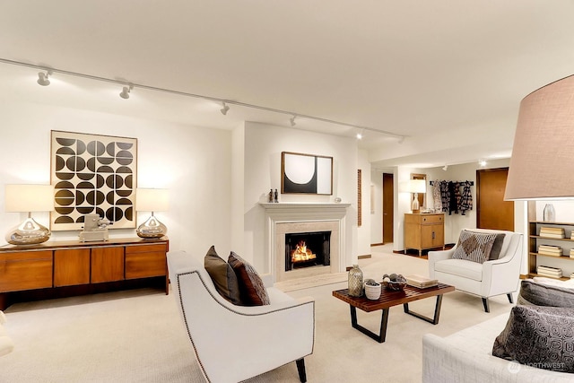 living room with rail lighting and light carpet