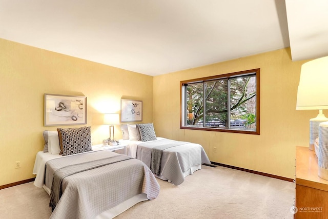 bedroom with light colored carpet