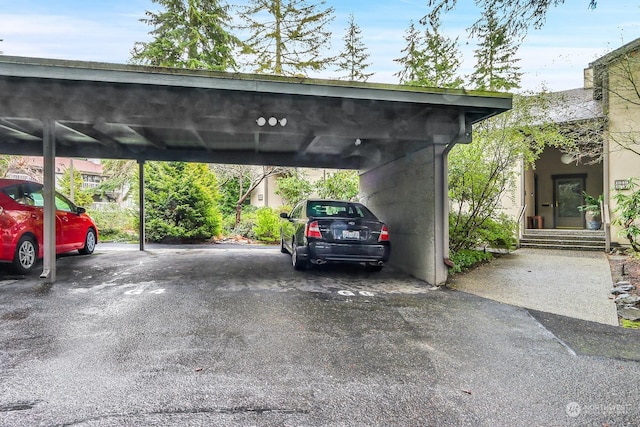 view of vehicle parking with a carport