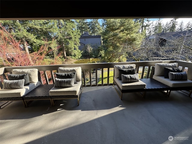 wooden deck with an outdoor living space