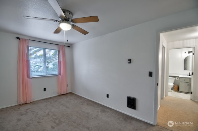 empty room featuring light carpet and ceiling fan