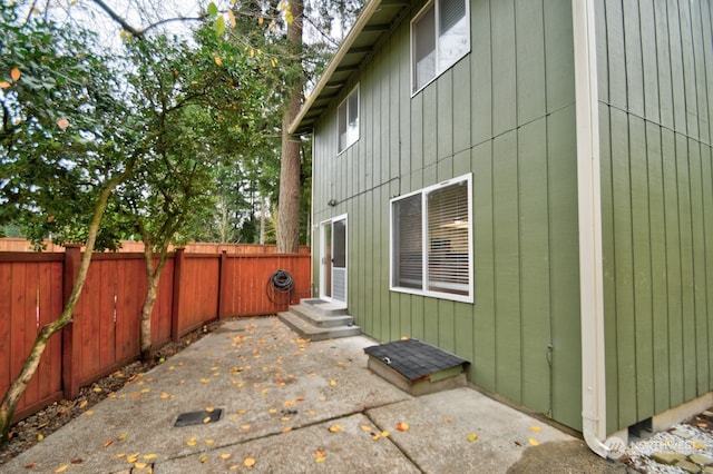 view of side of home with a patio area