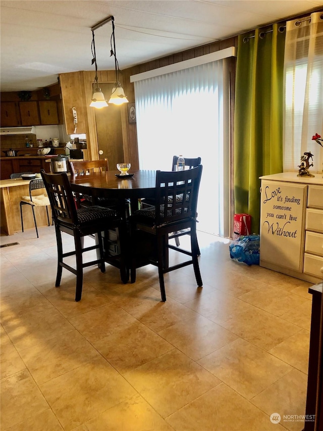 dining space with light tile patterned floors