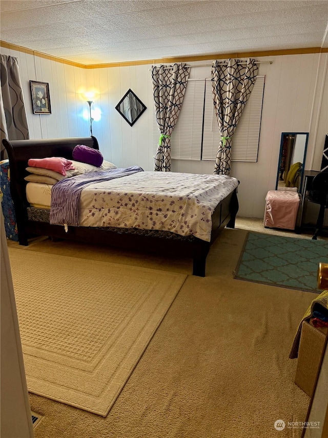 carpeted bedroom featuring crown molding and a textured ceiling