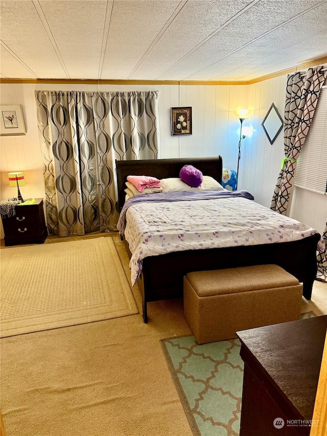 carpeted bedroom with a textured ceiling