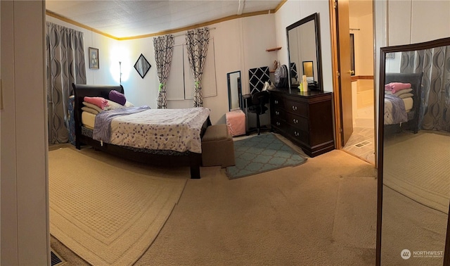 carpeted bedroom with crown molding